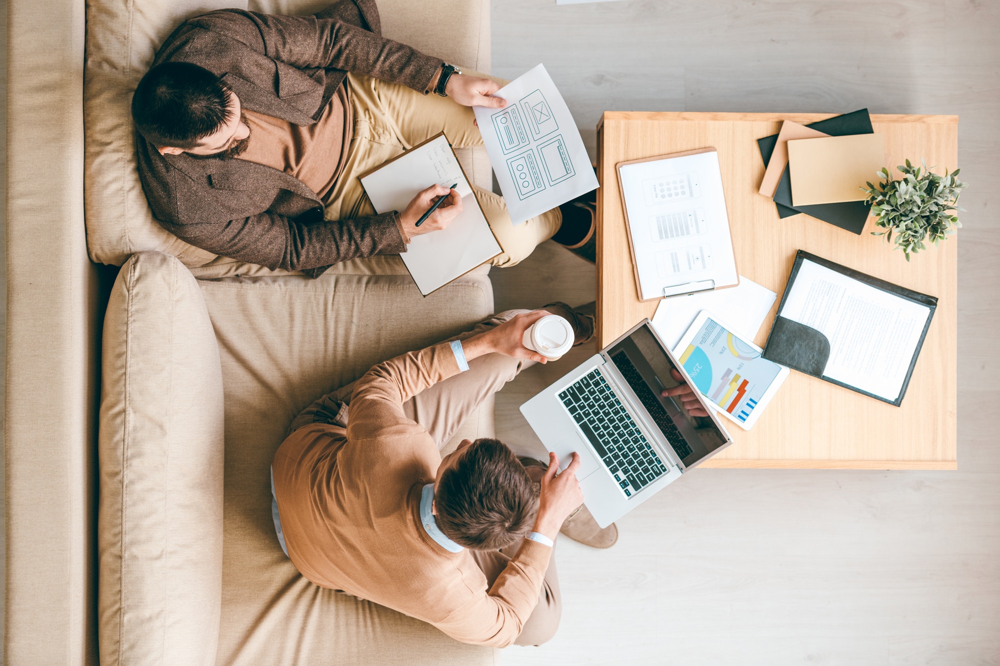 Two creative interface designers developing brand new software for smartphones